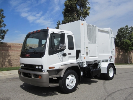 2007 GMC T7500 with Heil Retriever Satellite 10 Yard Side Load Refuse Truck